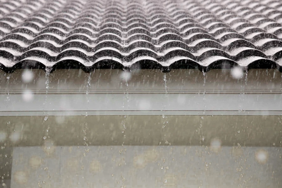 Impact of rain or hail on corrugated metal sheets creating noise in construction environments
